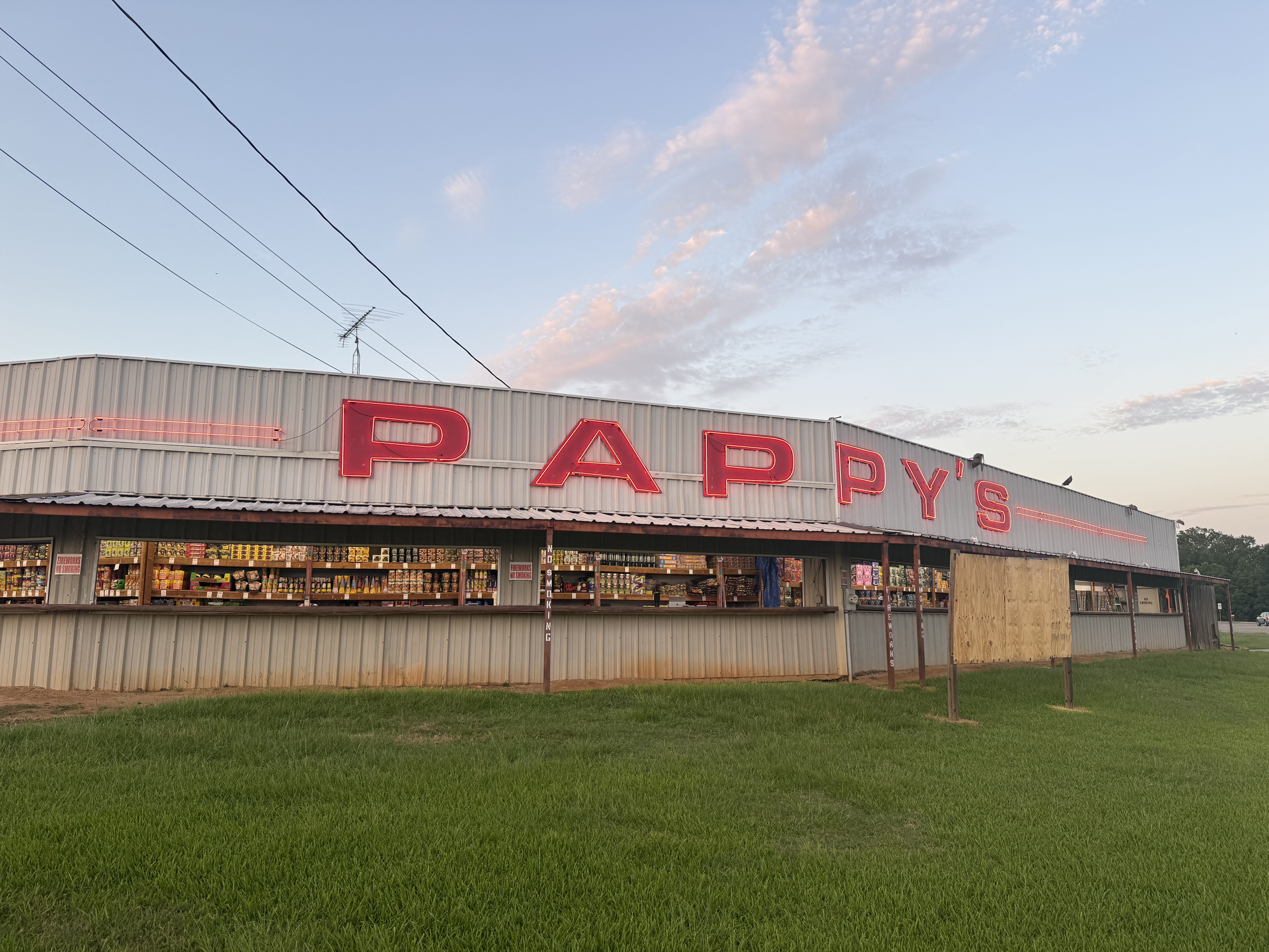 Pappy's Fireworks storefront with neon sign at dusk